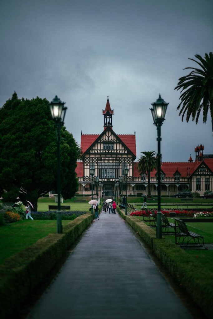 A long walkway leading to a large building